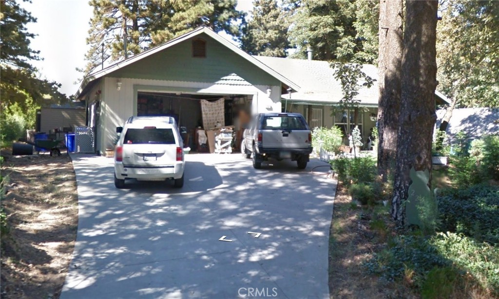 22070 Big Oak Road Cedarpines Park, CA 92322 - Photo 1 of 58 a view of a house with truck parked in a yard