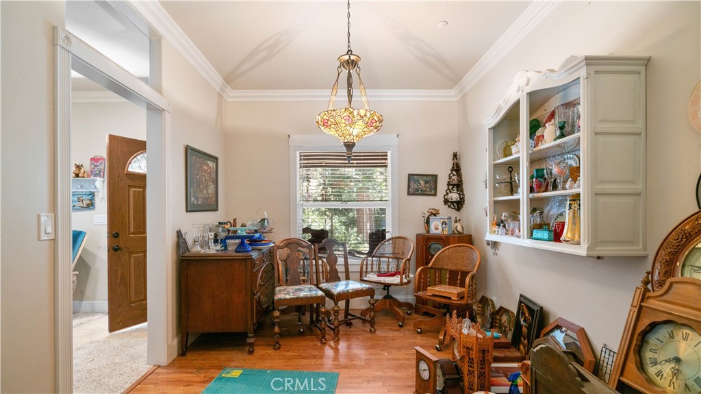 22070 Big Oak Road Cedarpines Park, CA 92322 - Photo 18 of 58 a living room with furniture and a chandelier