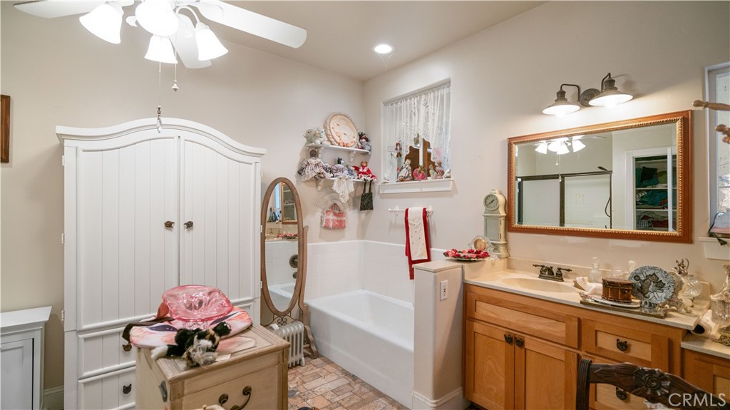 22070 Big Oak Road Cedarpines Park, CA 92322 - Photo 24 of 58 a bathroom with a sink mirror and vanity