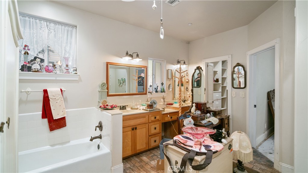 22070 Big Oak Road Cedarpines Park, CA 92322 - Photo 26 of 58 a bathroom with a sink mirror and a shower