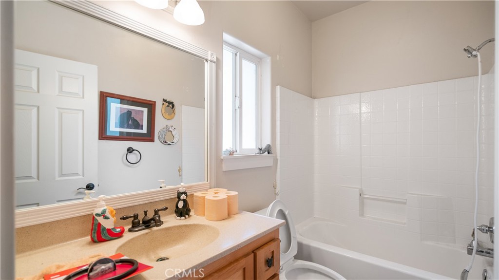 22070 Big Oak Road Cedarpines Park, CA 92322 - Photo 30 of 58 a bathroom with a sink vanity tub and toilet