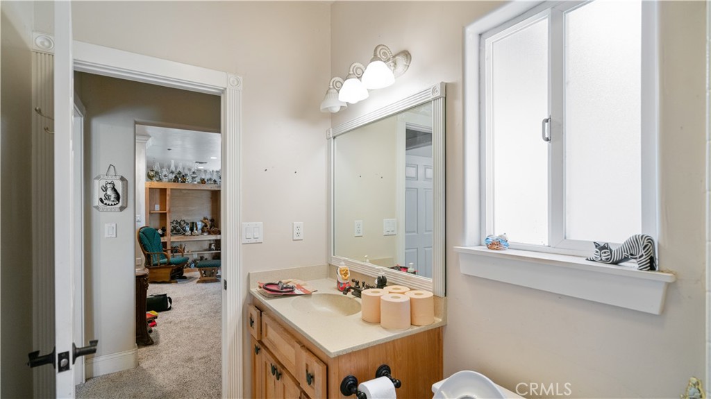 22070 Big Oak Road Cedarpines Park, CA 92322 - Photo 31 of 58 a bathroom with a sink vanity and mirror