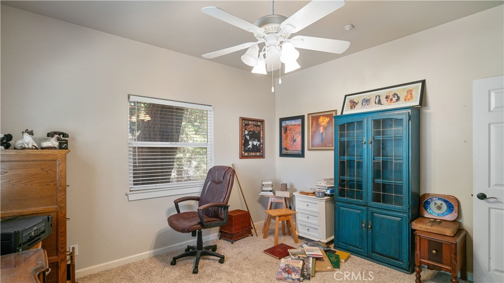 22070 Big Oak Road Cedarpines Park, CA 92322 - Photo 32 of 58 a livingroom with workspace fireplace and a window