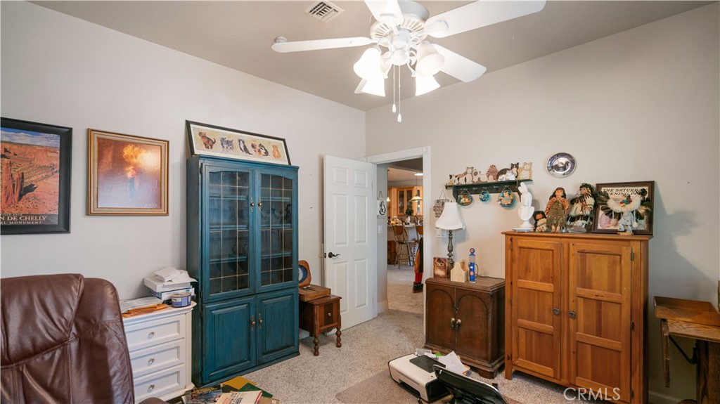 22070 Big Oak Road Cedarpines Park, CA 92322 - Photo 33 of 58 a view of a workspace with furniture and a window