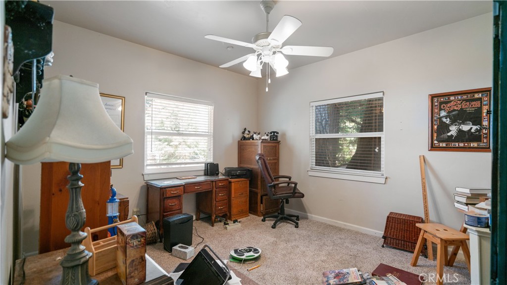 22070 Big Oak Road Cedarpines Park, CA 92322 - Photo 37 of 58 a view of a workspace with furniture and a window
