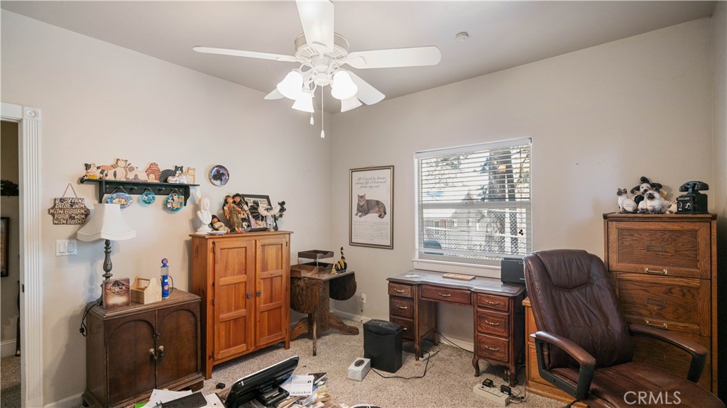 22070 Big Oak Road Cedarpines Park, CA 92322 - Photo 38 of 58 a view of a workspace with furniture and a window