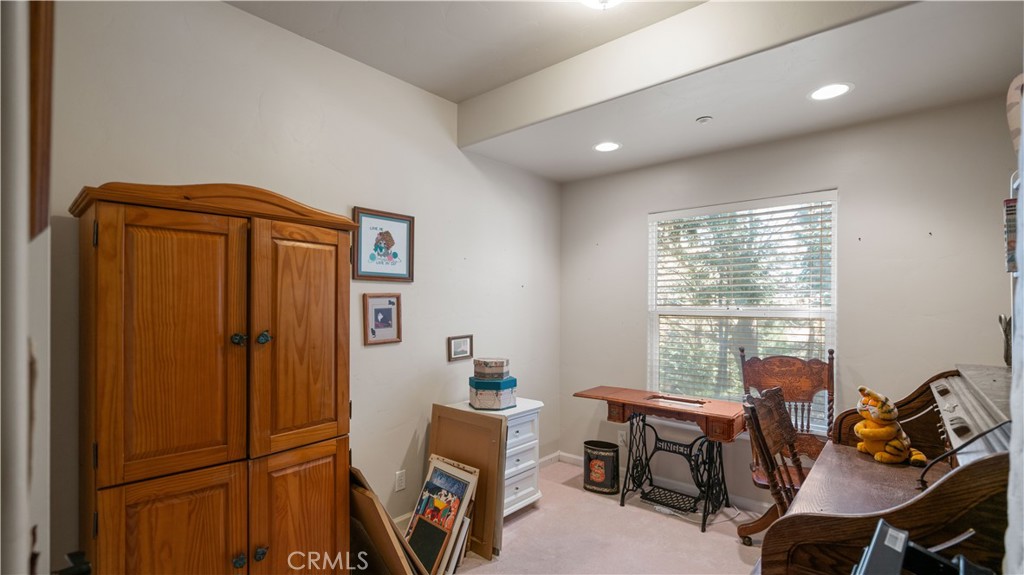 22070 Big Oak Road Cedarpines Park, CA 92322 - Photo 39 of 58 a view of a workspace with furniture and a window