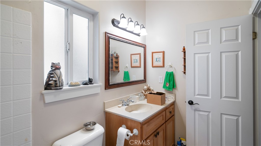 22070 Big Oak Road Cedarpines Park, CA 92322 - Photo 40 of 58 a bathroom with a sink vanity and a mirror
