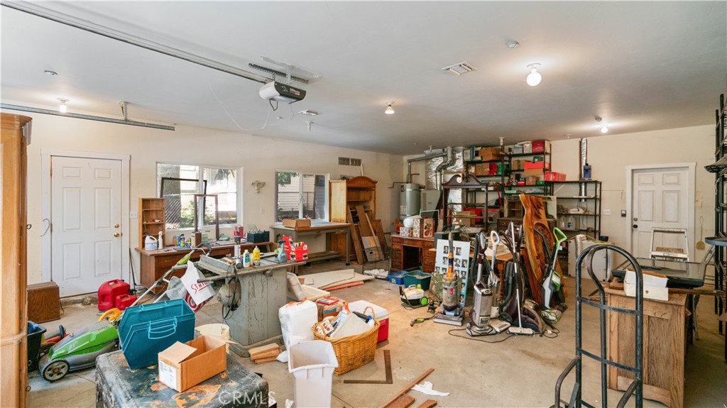 22070 Big Oak Road Cedarpines Park, CA 92322 - Photo 4 of 58 a living room with lots of gym equipment