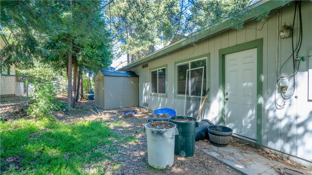 22070 Big Oak Road Cedarpines Park, CA 92322 - Photo 44 of 58 a view of a backyard with table and chairs and potted plants