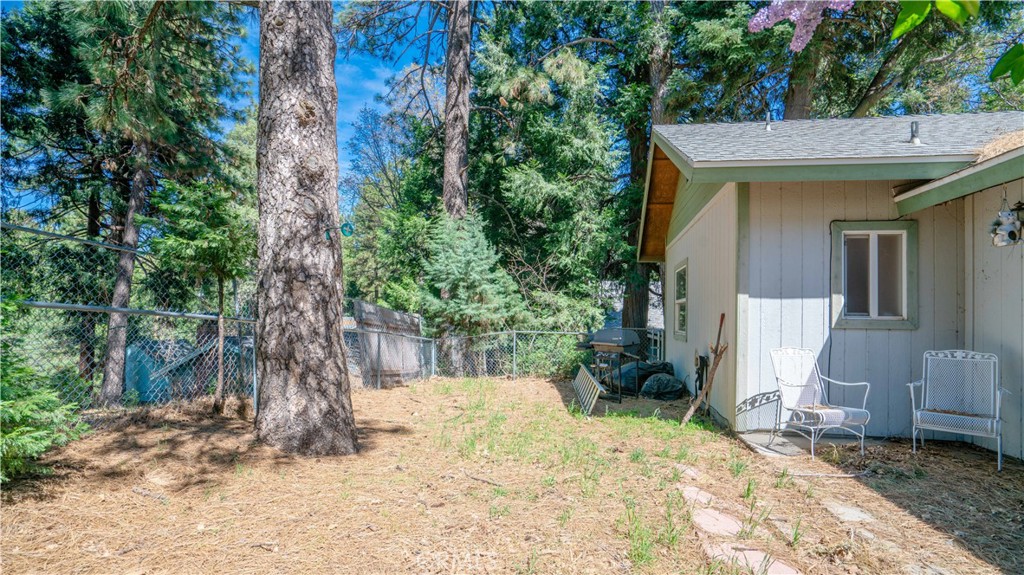 22070 Big Oak Road Cedarpines Park, CA 92322 - Photo 53 of 58 front view of a house with a yard