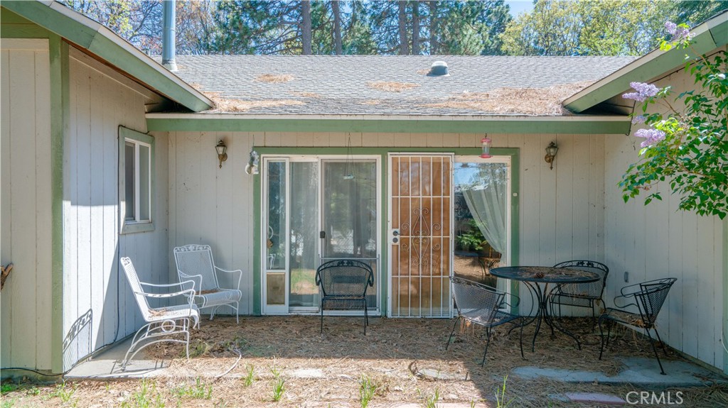 22070 Big Oak Road Cedarpines Park, CA 92322 - Photo 56 of 58 a backyard of a house with chairs