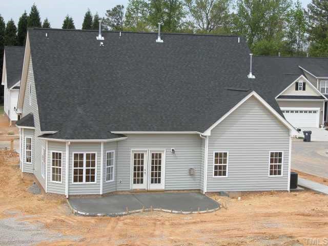 152 Sharp Top Trail Apex, NC 27502 - Photo 2 of 10 a view of a house with a backyard