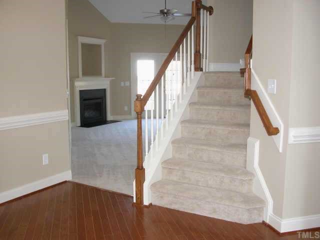 152 Sharp Top Trail Apex, NC 27502 - Photo 3 of 10 a view of entryway and hall with wooden floor