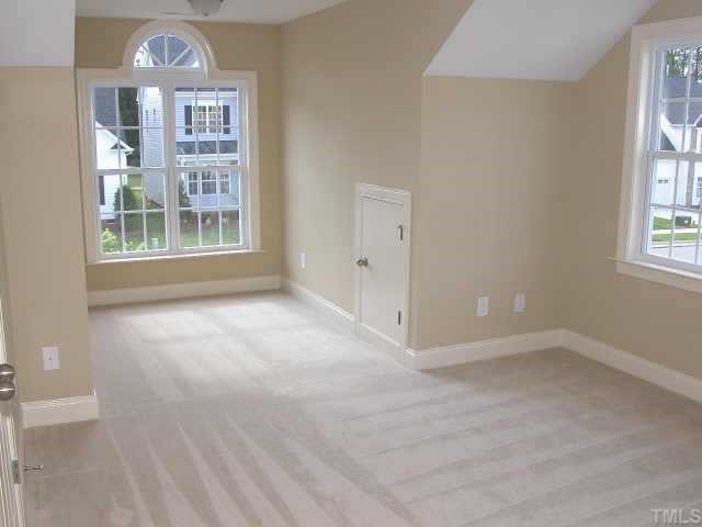 152 Sharp Top Trail Apex, NC 27502 - Photo 4 of 10 an empty room with windows