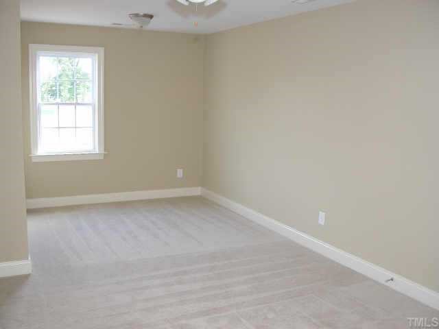 152 Sharp Top Trail Apex, NC 27502 - Photo 5 of 10 an empty room with a window