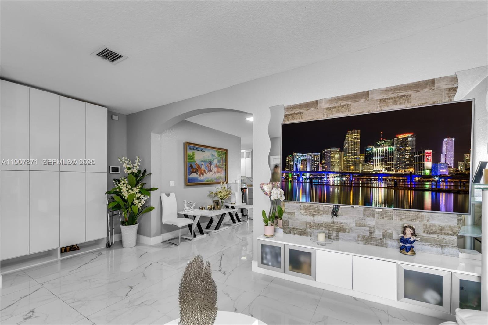 13381 Southwest 269th Street Homestead, FL 33032 - Photo 11 of 44 a kitchen with stainless steel appliances kitchen island granite countertop a refrigerator and a sink