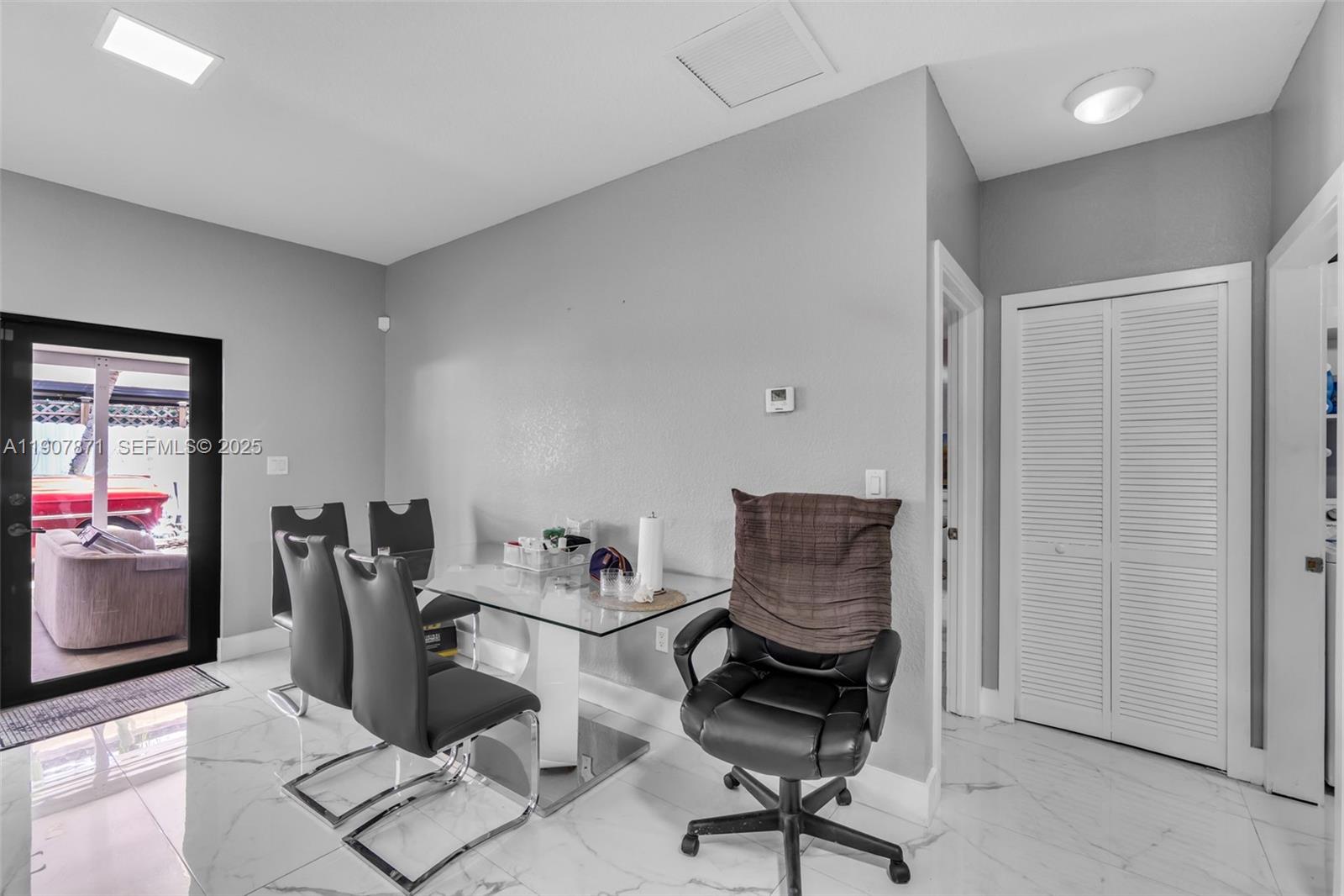 13381 Southwest 269th Street Homestead, FL 33032 - Photo 18 of 44 a view of workspace filled with furniture and gym equipment