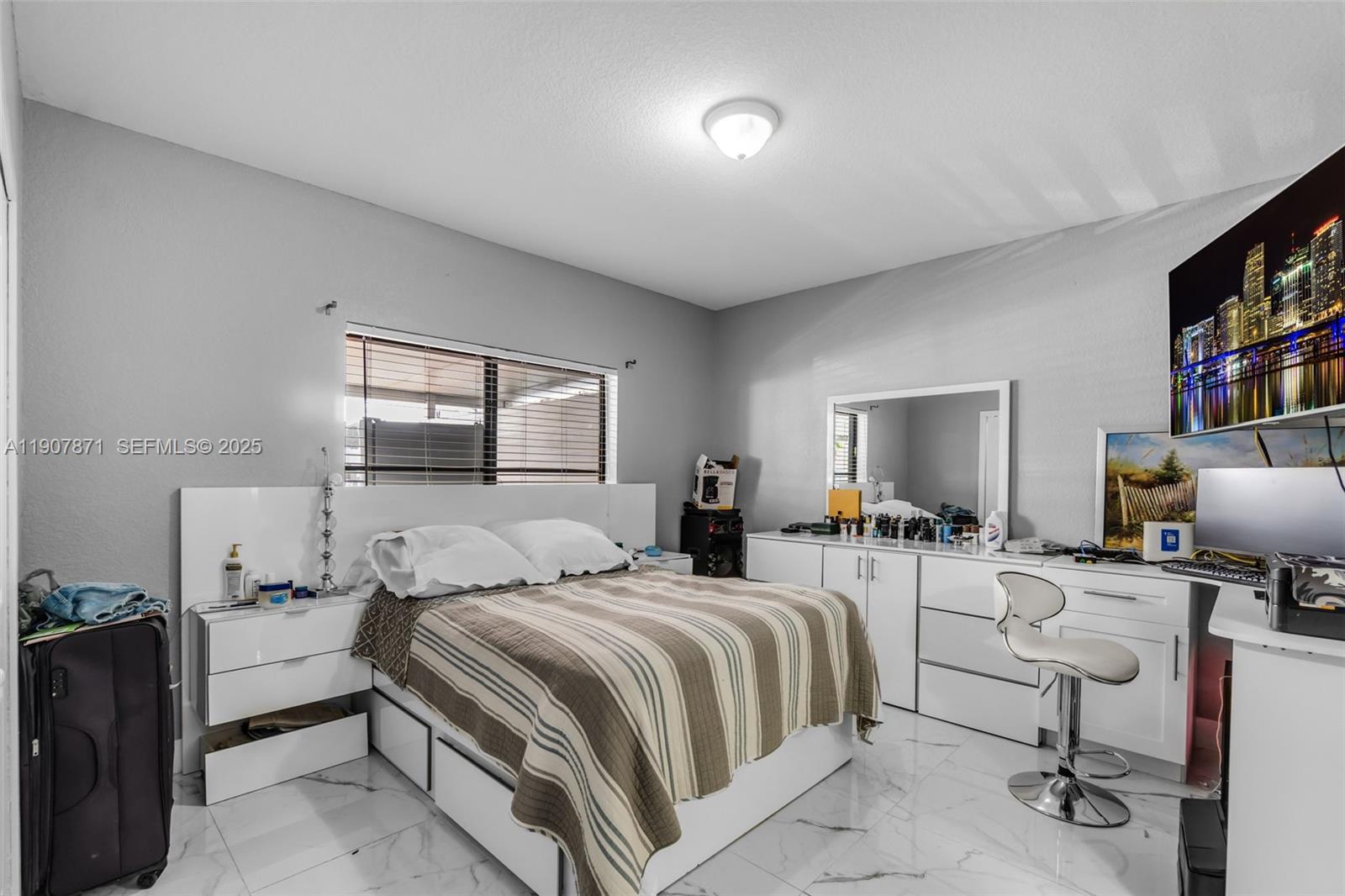 13381 Southwest 269th Street Homestead, FL 33032 - Photo 19 of 44 a bedroom with a bed and large windows