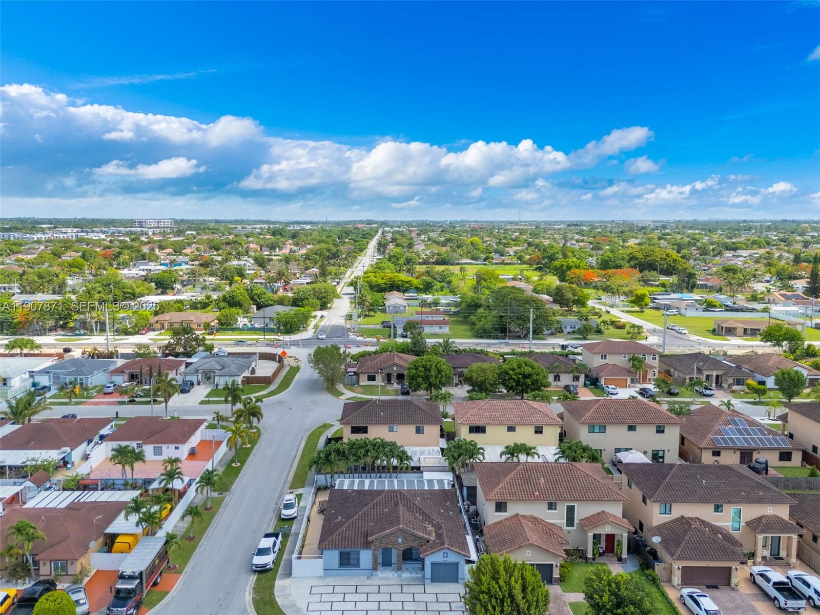 13381 Southwest 269th Street Homestead, FL 33032 - Photo 2 of 44 an aerial view of residential houses with outdoor space