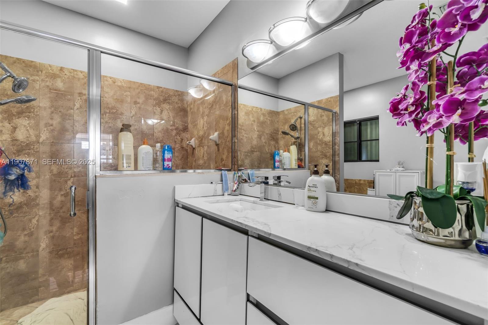 13381 Southwest 269th Street Homestead, FL 33032 - Photo 21 of 44 a bathroom with a sink and a mirror