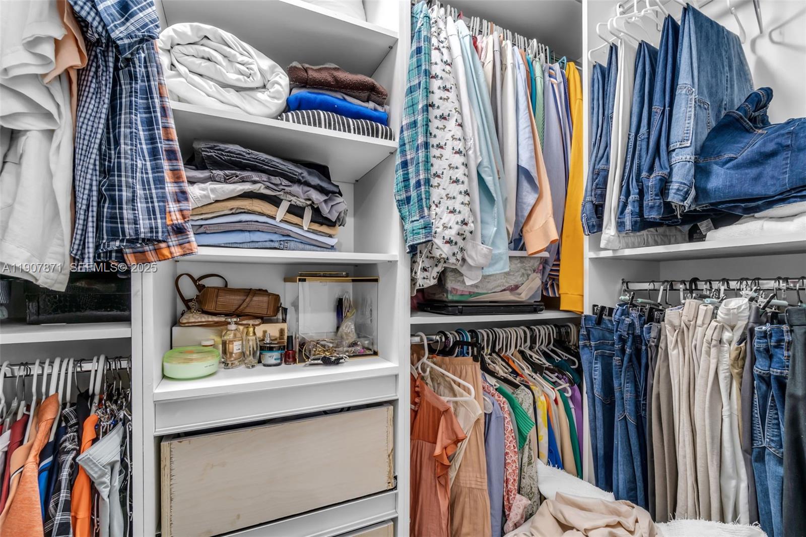 13381 Southwest 269th Street Homestead, FL 33032 - Photo 23 of 44 a view of walk in closet with clothes and shoes