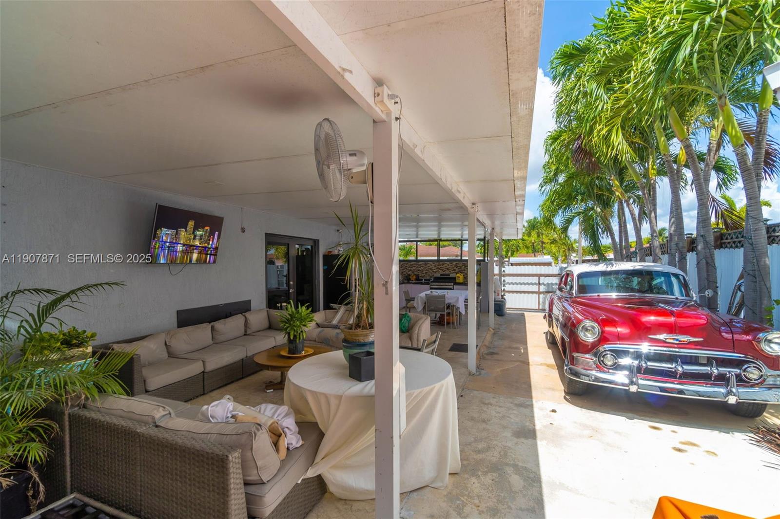 13381 Southwest 269th Street Homestead, FL 33032 - Photo 36 of 44 a living room with furniture and a potted plant