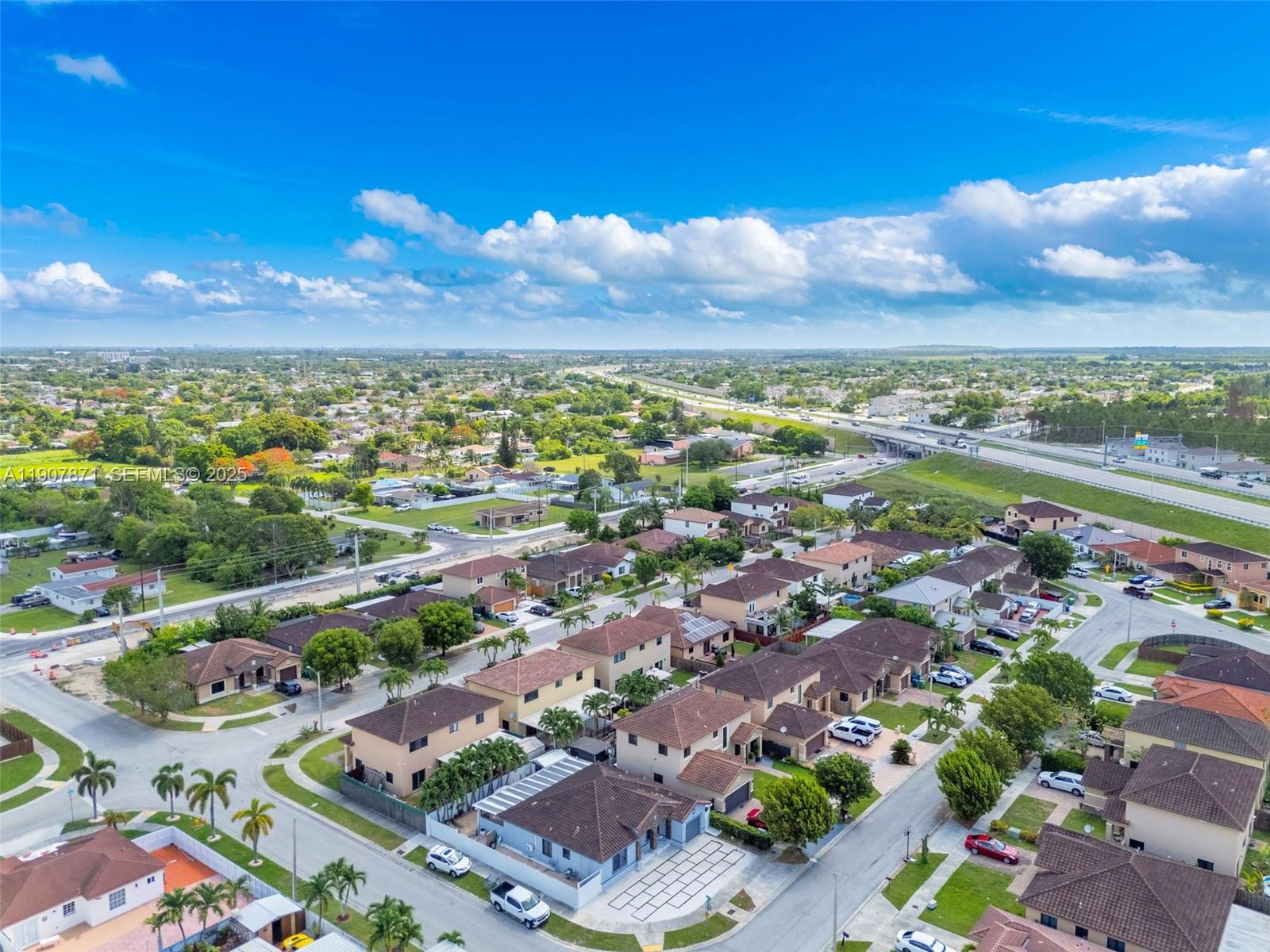 13381 Southwest 269th Street Homestead, FL 33032 - Photo 38 of 44 a view of a city with a lake