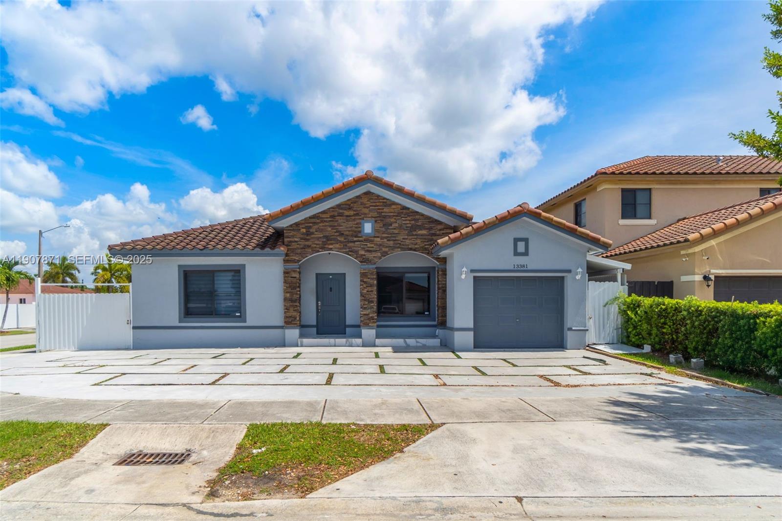13381 Southwest 269th Street Homestead, FL 33032 - Photo 6 of 44 a front view of a house with yard