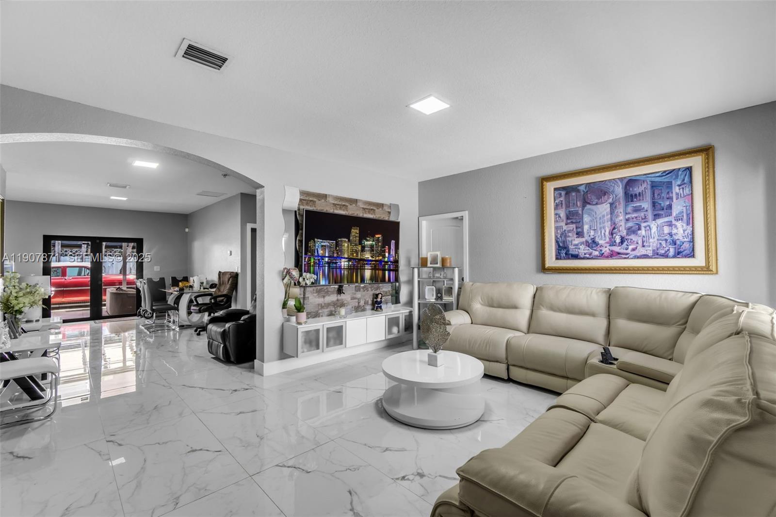 13381 Southwest 269th Street Homestead, FL 33032 - Photo 10 of 44 a living room with furniture and a wooden floor
