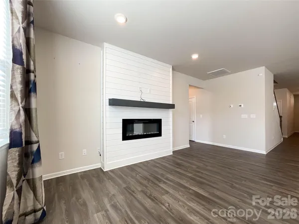 a view of kitchen with a sink and a large window
