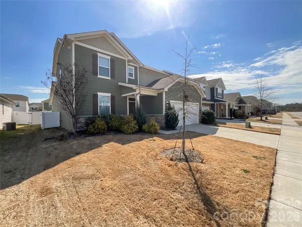 a front view of a house with a yard
