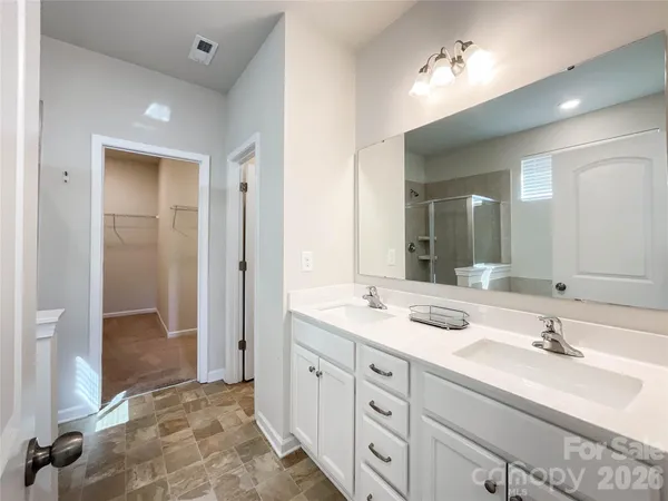 a bathroom with a bathtub and a sink