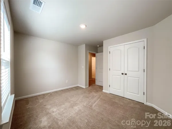 a room with gym equipment and a window