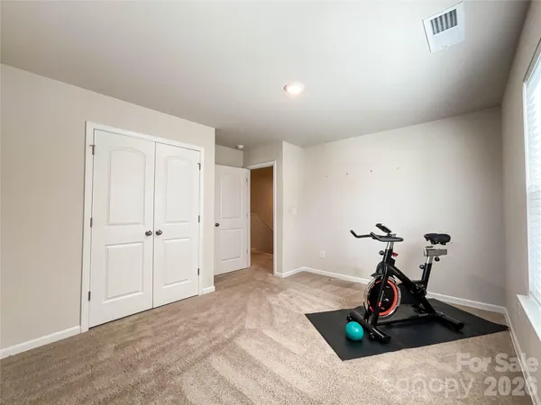 a bathroom with a double vanity sink toilet mirror and shower