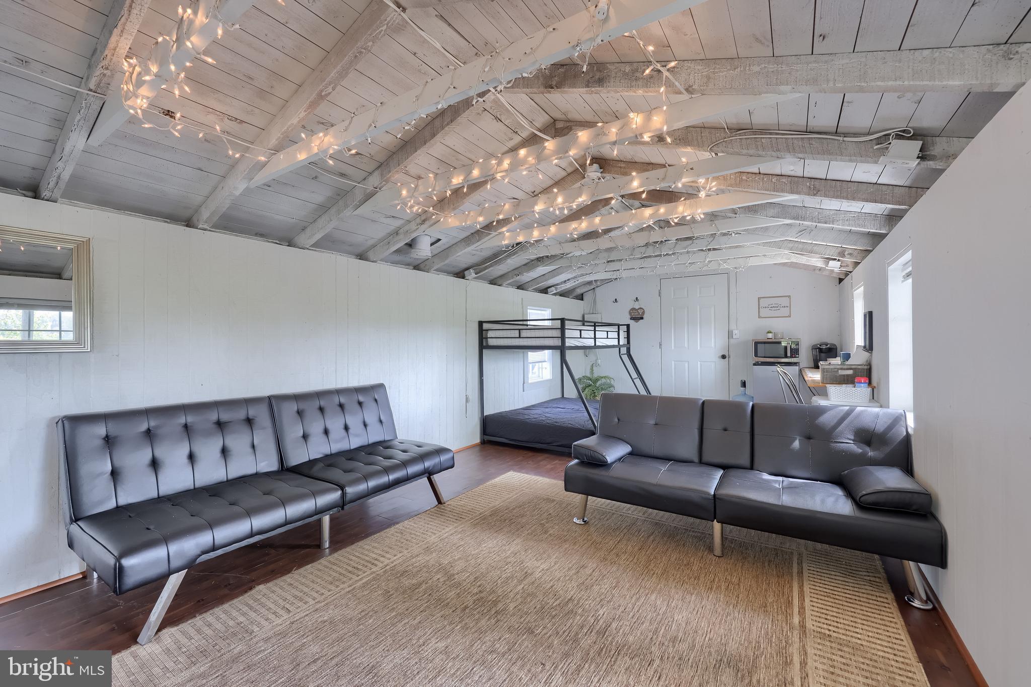 283 Skyview Lane Lititz, PA 17543 - Photo 14 of 28 a living room with furniture and a chandelier