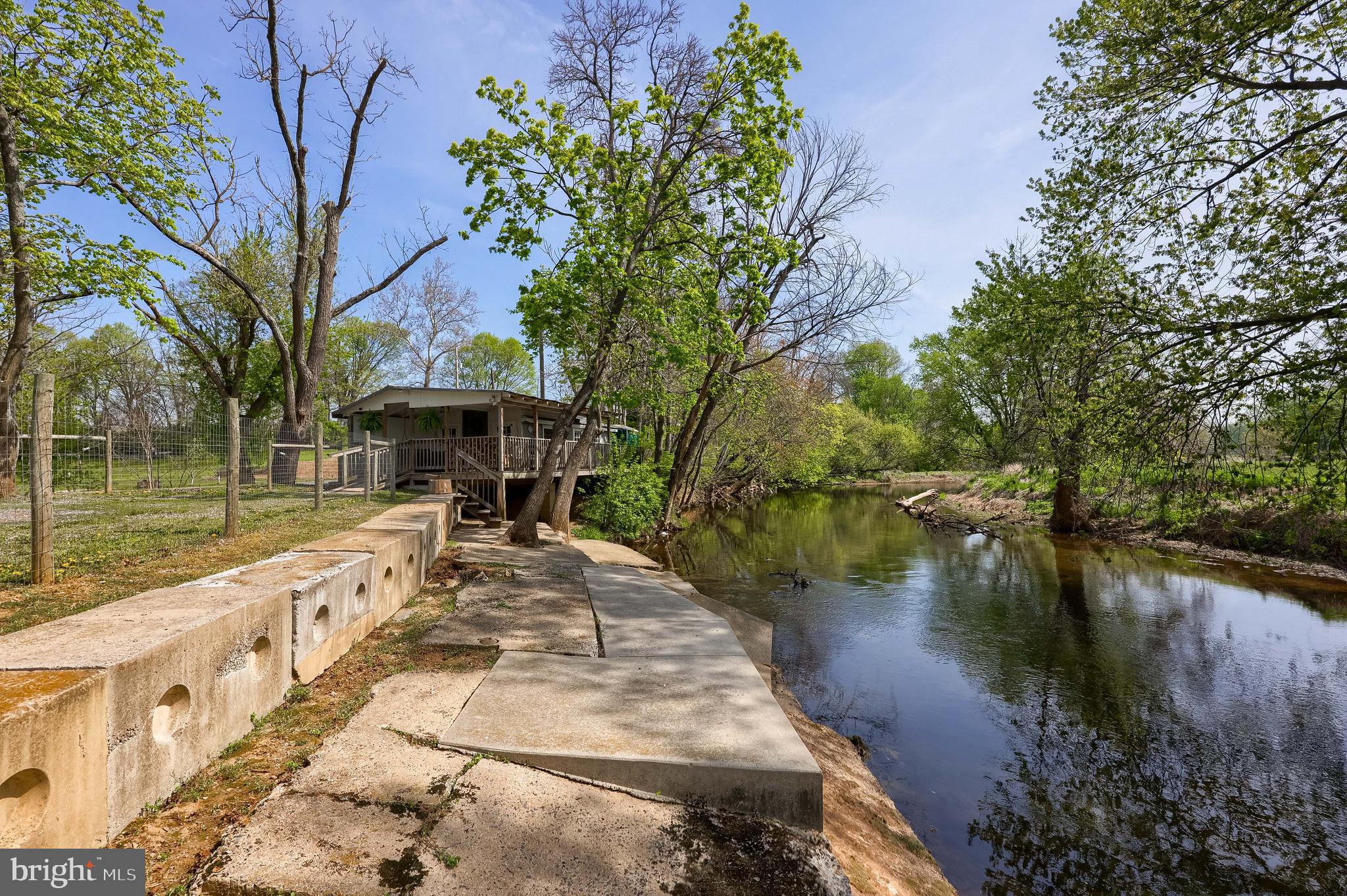 283 Skyview Lane Lititz, PA 17543 - Photo 22 of 28 a view of a lake with a house in the background