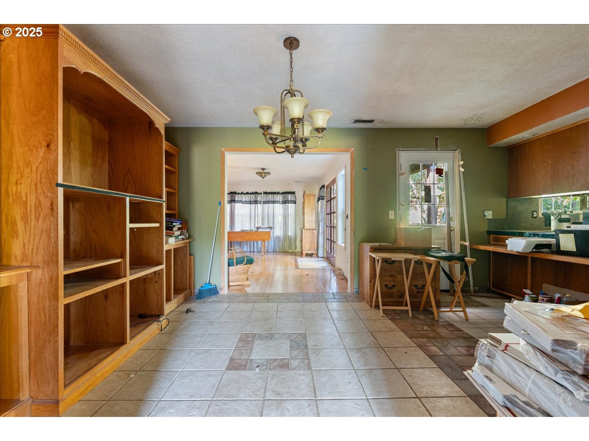 2617 Northeast 166th Street Ridgefield, WA 98642 - Photo 23 of 35 a view of dining room with furniture and a chandelier