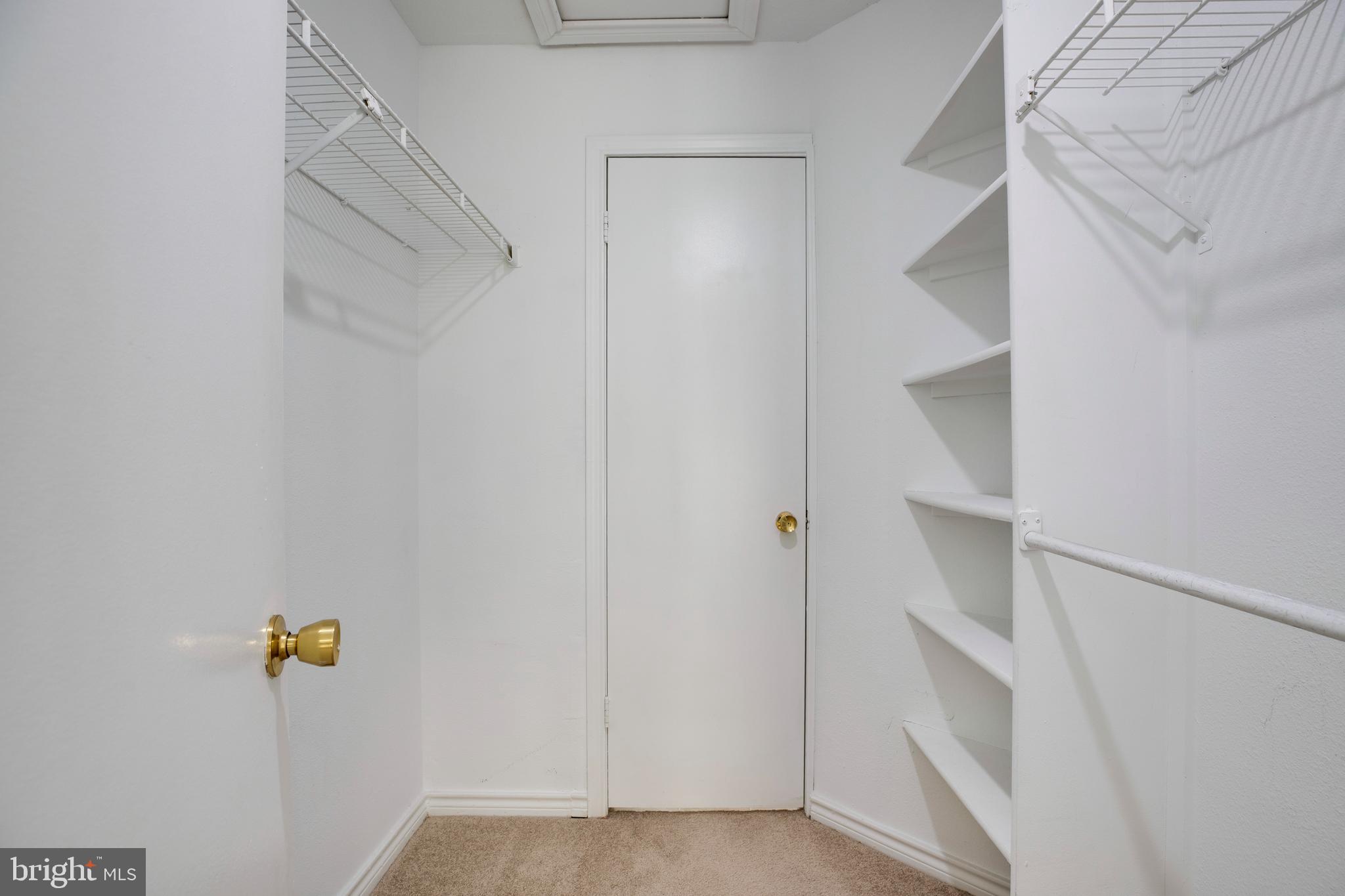 12154 Penderview Terrace, Unit 1231 Fairfax, VA 22033 - Photo 16 of 25 a view of walk in closet with empty racks