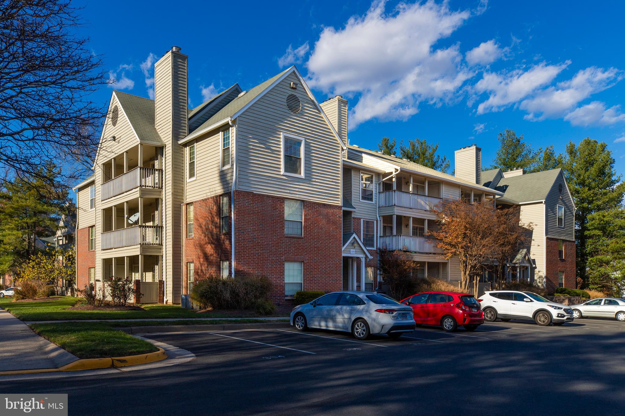12154 Penderview Terrace, Unit 1231 Fairfax, VA 22033 - Photo 2 of 25 a front view of a building with street view