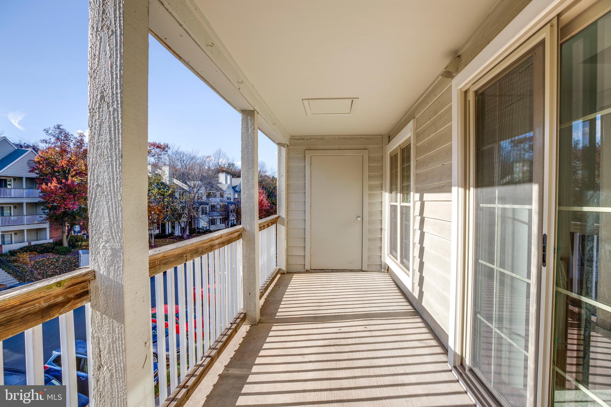 12154 Penderview Terrace, Unit 1231 Fairfax, VA 22033 - Photo 24 of 25 a view of a balcony with wooden floor