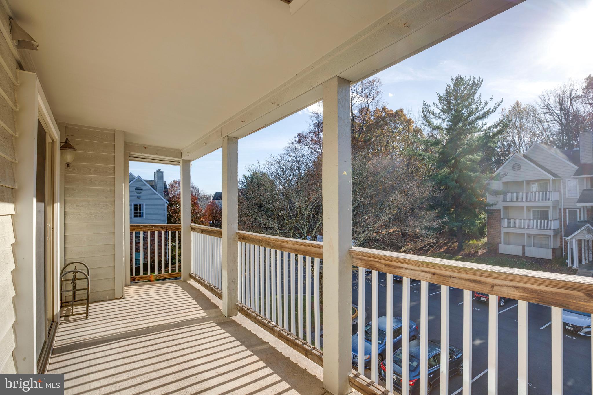 12154 Penderview Terrace, Unit 1231 Fairfax, VA 22033 - Photo 25 of 25 a view of a balcony with wooden floor