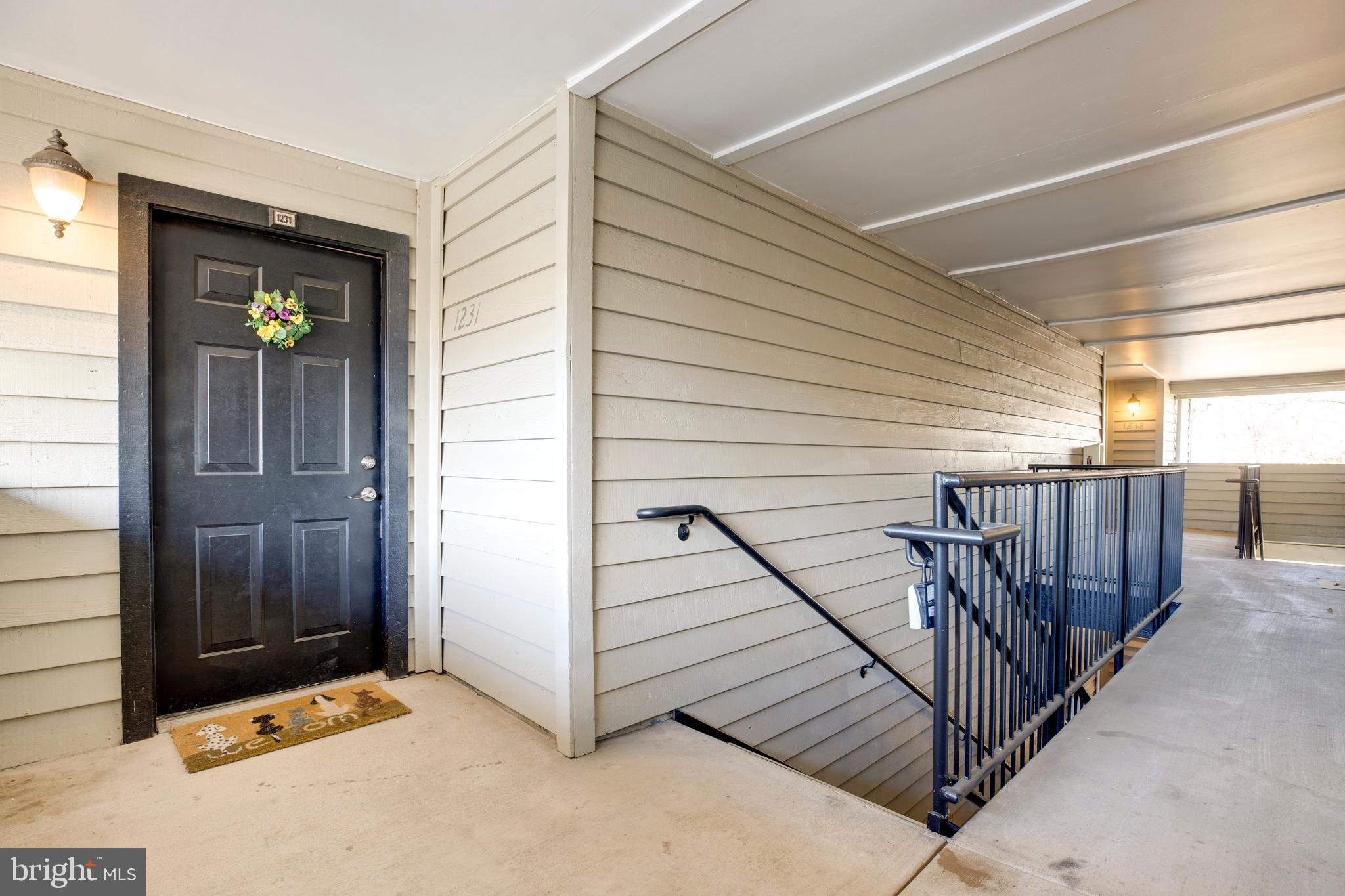 12154 Penderview Terrace, Unit 1231 Fairfax, VA 22033 - Photo 3 of 25 a view of a balcony with staircase