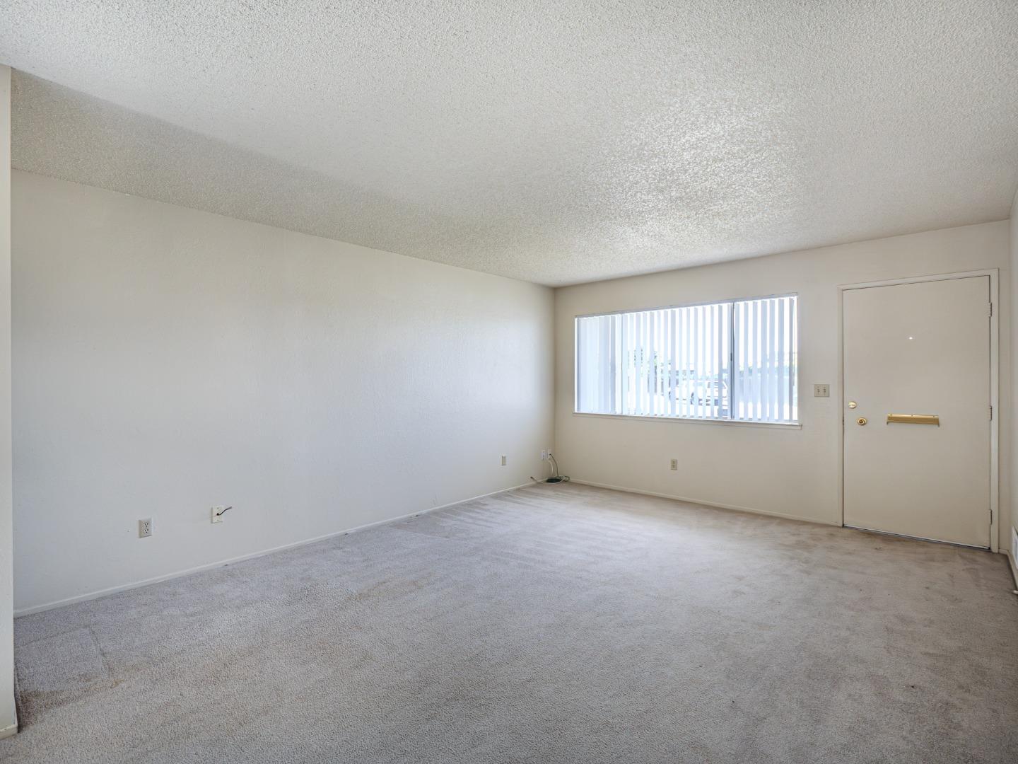 450 Spruce Circle Watsonville, CA 95076 - Photo 15 of 30 an empty room with windows