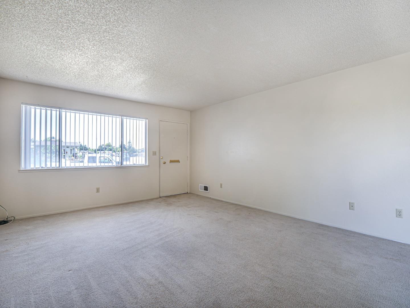 450 Spruce Circle Watsonville, CA 95076 - Photo 16 of 30 an empty room with windows