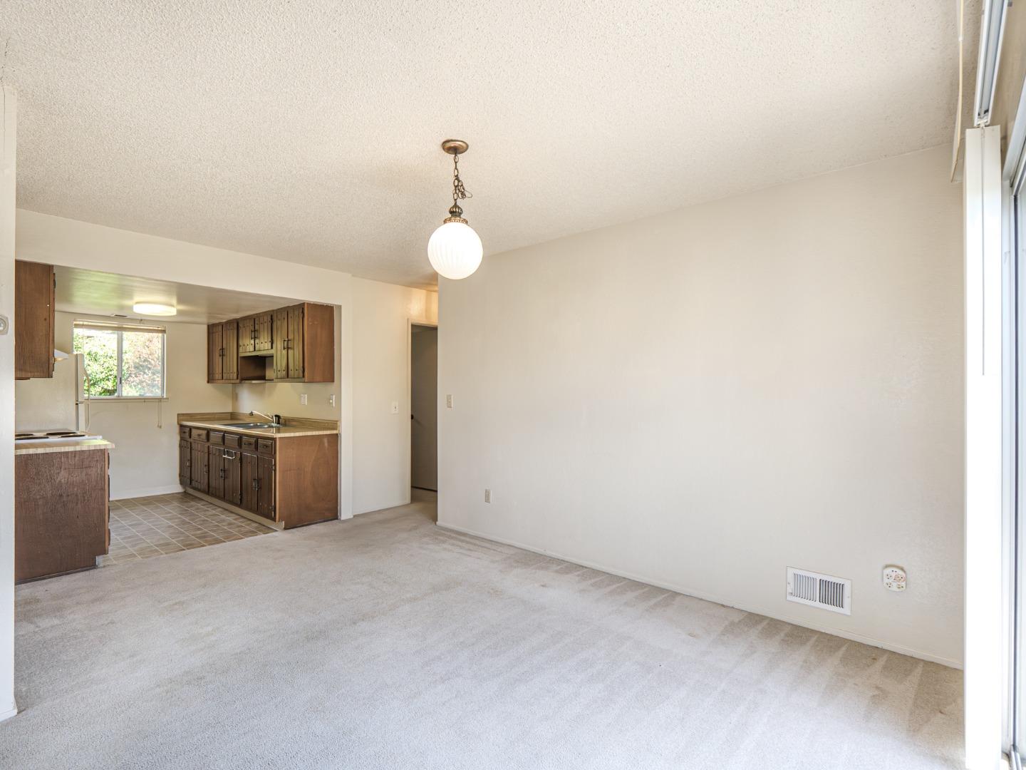 450 Spruce Circle Watsonville, CA 95076 - Photo 17 of 30 a view of a kitchen with a sink and dishwasher a oven with white countertops