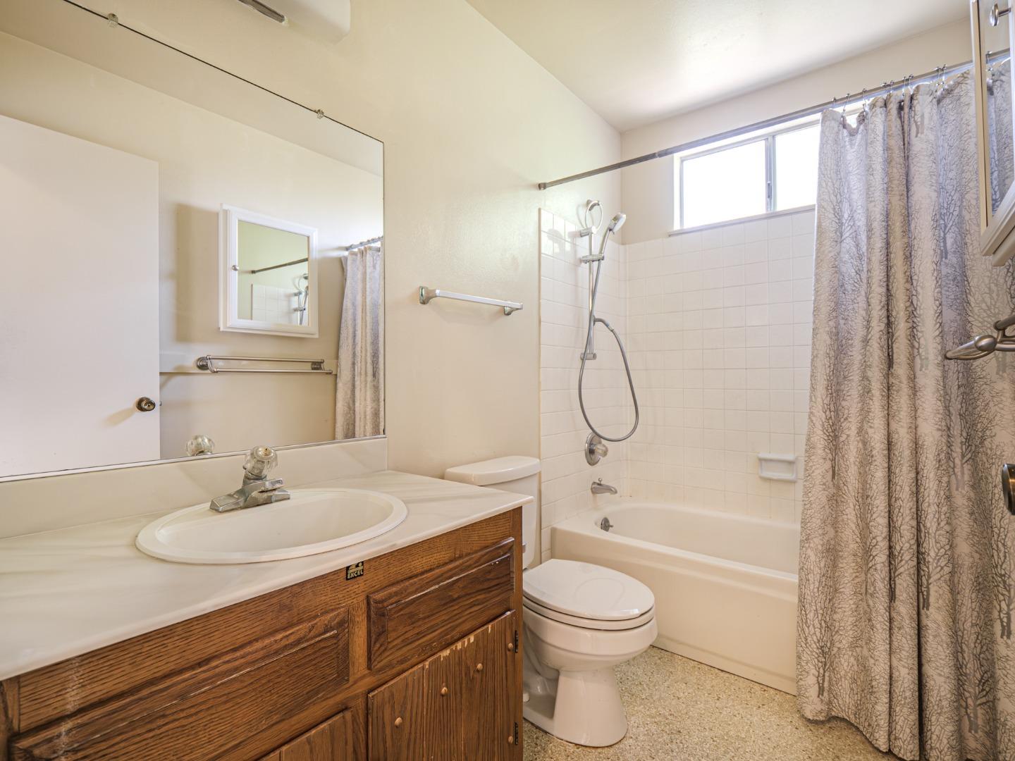 450 Spruce Circle Watsonville, CA 95076 - Photo 29 of 30 a bathroom with a sink a toilet and shower
