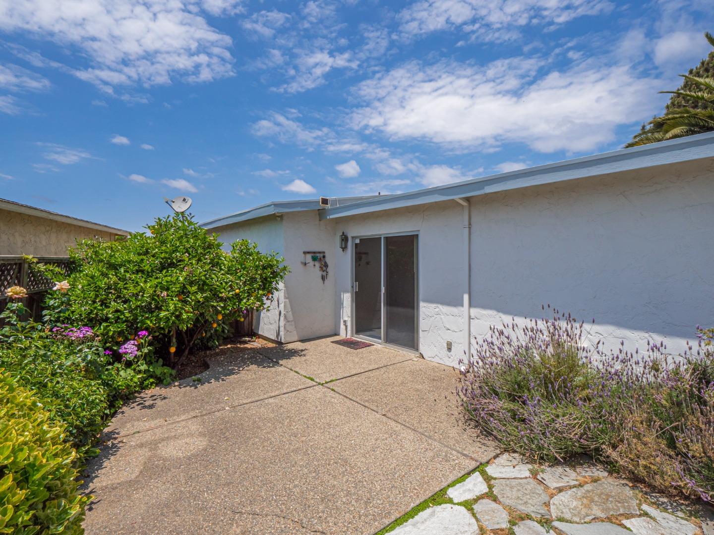 450 Spruce Circle Watsonville, CA 95076 - Photo 4 of 30 a front view of a house with a yard