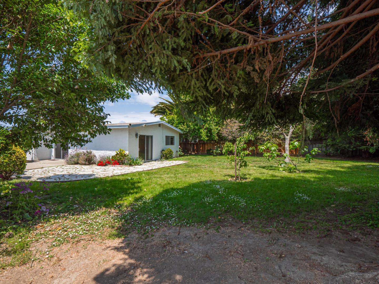 450 Spruce Circle Watsonville, CA 95076 - Photo 7 of 30 a front view of a house with a garden