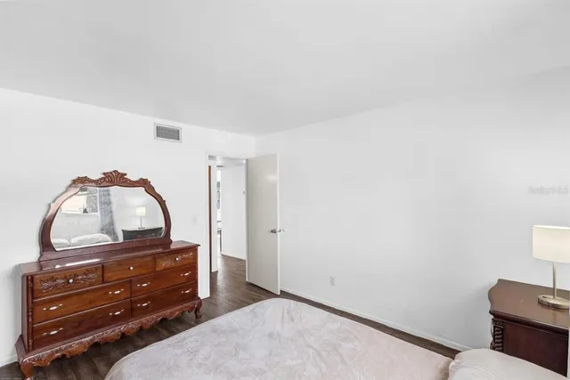 a room with a dresser and a mirror